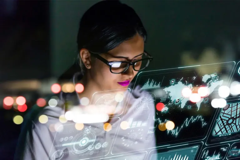 A women with glasses working on an interface screen